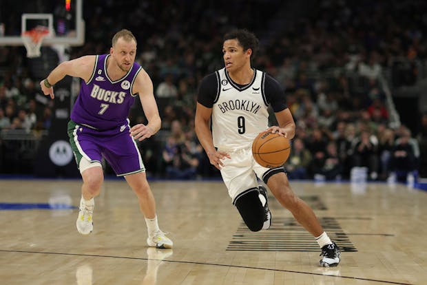 Dru Smith of the Brooklyn Nets drives to the basket against Joe Ingles of the Milwaukee Bucks (Photo by Stacy Revere/Getty Images)