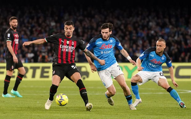 Rade Krunic of AC Milan competes for the ball with Stanislav Lobotka and Khvicha Kvaratskhelia of SSC Napoli (by MB Media/Getty Images)