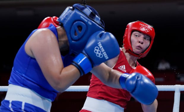 Lauren Price of Great Britain exchanges punches with Myagmarjargal Munkhbat of Mongolia (Photo by Frank Franklin - Pool/Getty Images)