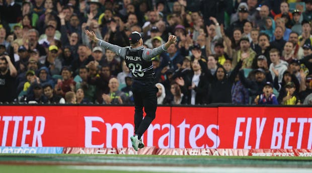 Glenn Phillips of New Zealand celebrates catching Marcus Stoinis of Australia (Photo by Mark Kolbe/Getty Images)