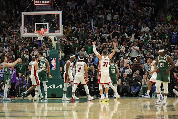 The Miami Heat celebrate after defeating the Milwaukee Bucks in the Eastern Conference First Round Playoffs (by Stacy Revere/Getty Images)