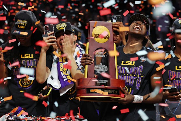 LSU players hold the championship trophy after defeating Iowa 102-85 in the 2023 NCAA Women's Basketball Tournament championship game (Getty Images)