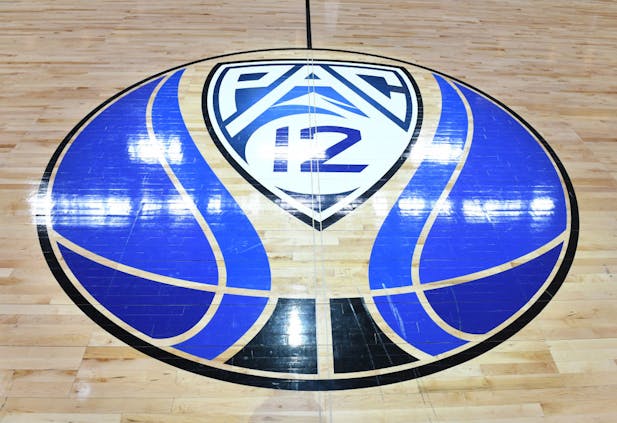 The Pac-12 logo on a basketball court (Getty Images)