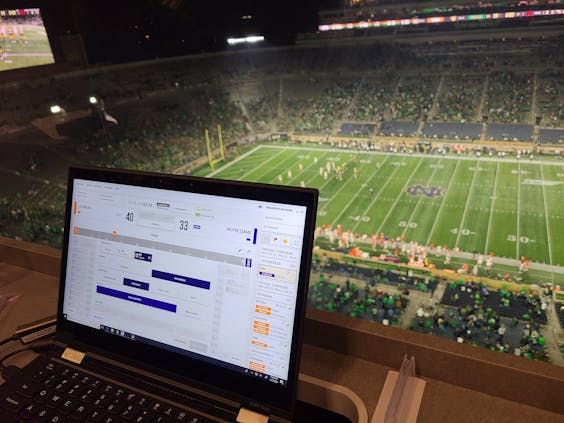 NCAA LiveStats being used at an NCAA football game (Credit: Gemini/Genius)