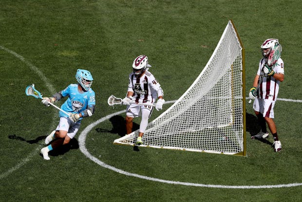 COMMERCE CITY, COLORADO - JULY 27: Eric Law of Atlas LC looks for an opening on goal against Patrick Harbeson and Tim Troutner of Redwoods LC in the fourth quarter during week six of the Premier Lacrosse League. (Photo by Matthew Stockman/Getty Images)