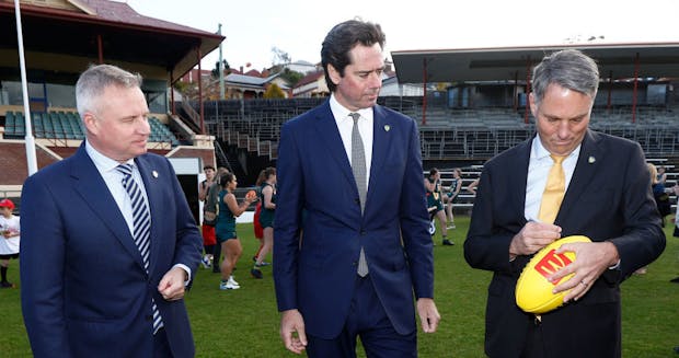 (L-R) Tasmanian Premier Jeremy Rockliff; Gillon McLachlan, CEO of the AFL; and Deputy PM Richard Marles (by Michael Willson/AFL Photos via Getty Images) 