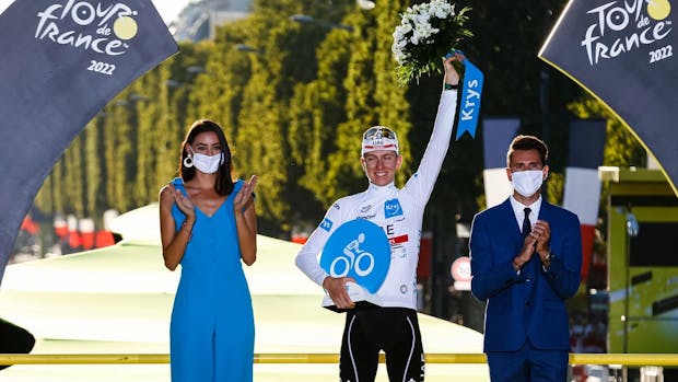 Tadej Pogacar celebrates with the best young rider's white jersey after the 21st and final stage of the 2022 Tour de France. (Antonio Borga/Eurasia Sport Images/Getty)