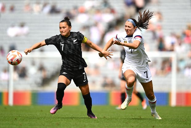 Ali Riley of New Zealand competes with Ashley Hatch of USA (Photo by Hannah Peters/Getty Images)