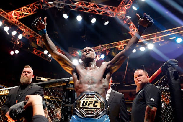 MIAMI, FLORIDA - APRIL 08: Israel Adesanya of Nigeria celebrates after knocking out Alex Pereira to reclaim the middleweight title during UFC 287. (Photo by Carmen Mandato/Getty Images)