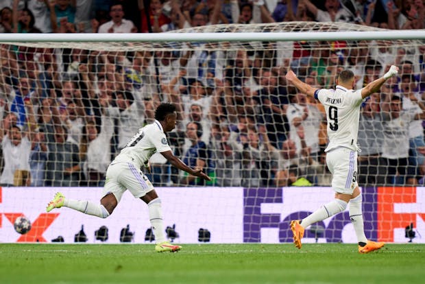 Vinicius Junior of Real Madrid celebrates after scoring during 2022-23 UEFA Champions League semi-final vs Manchester City in Madrid (Photo by Diego Souto/Quality Sport Images/Getty Images)