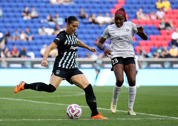 Ali Krieger of NJ/NY Gotham FC and Messiah Bright of the Orlando Pride. (Photo by Elsa/Getty Images)