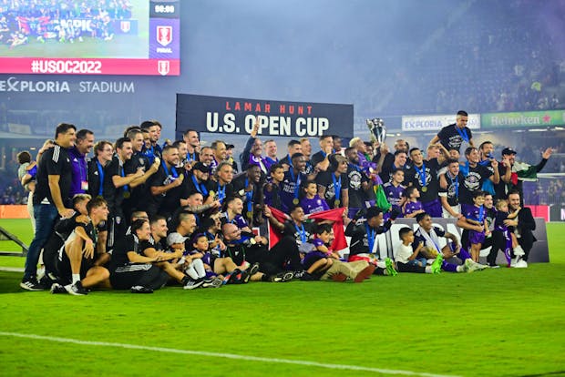 Orlando City hoist the trophy after winning the Lamar Hunt U.S. Open Cup in 2022 (Photo by Julio Aguilar/Getty Images)
