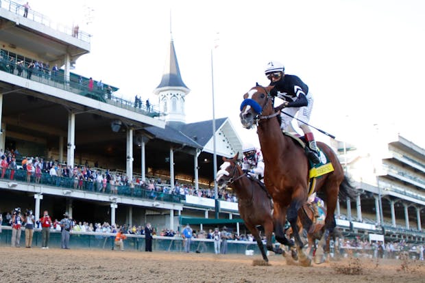 Authentic, ridden by jockey John Velazquez, crosses the finish line after winning the 146th running of the Kentucky Derby (Photo by Rob Carr/Getty Images)