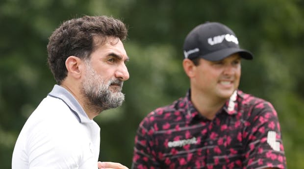 Patrick Reed (R) and Yasir al-Rumayyan, head of the PIF sovereign wealth fund at Trump National Golf Club Bedminster (Photo by Cliff Hawkins/Getty Images)