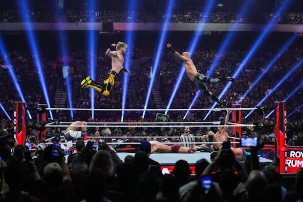 Logan Paul and Ricochet wrestle during the WWE Royal Rumble at the Alamodome in January 2023 in San Antonio, Texas. (Alex Bierens de Haan/Getty Images)
