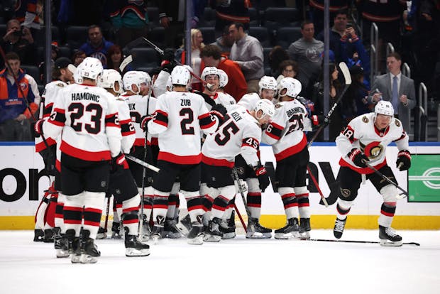 The Ottawa Senators celebrate their 3-2 shootout win against the New York Islanders. (Photo by Al Bello/Getty Images)