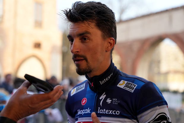 Julian Alaphilippe of Team Soudal Quick-Step interviewed prior to the 2023 Milano-Sanremo team presentation (by Sara Cavallini/Getty Images)