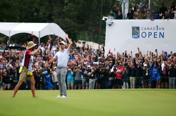 Nick Taylor tosses his club in celebration after making an eagle putt on the fourth playoff hole to win the 2023 RBC Canadian Open (by Vaughn Ridley/Getty Images)