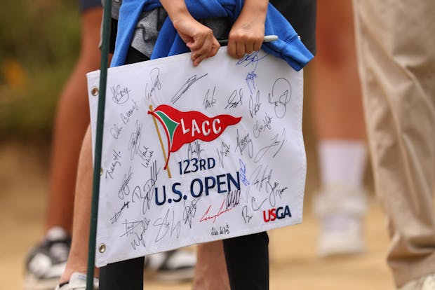 Fan holds US Open flag at The Los Angeles Country Club on June 13, 2023 (Photo by Andrew Redington/Getty Images)