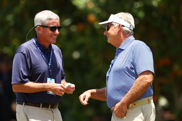 Commissioner Jay Monahan (L) speaks to PGA Tour board member Jimmy Dunne (R) (by Mike Ehrmann/Getty Images)