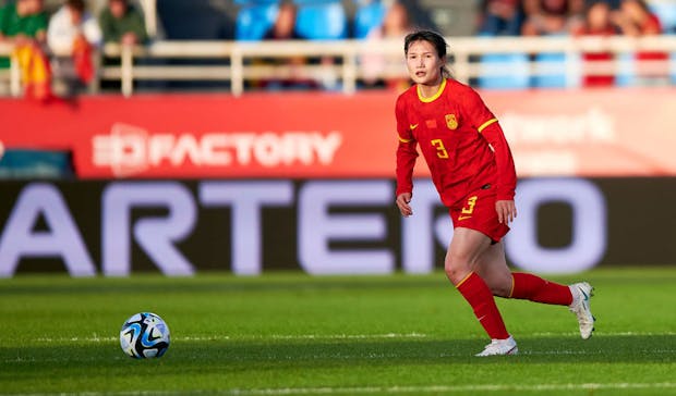 Dou Jiaxing of China with the ball during the women's international friendly match against Spain (Photo by Cristian Trujillo/Quality Sport Images/Getty Images)