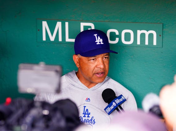 A Spectrum Sportsnet microphone is in the shot as manager Dave Roberts  of the Los Angeles Dodgers gives an interview in 2019. (Photo by Omar Rawlings/Getty Images)
