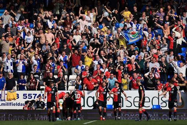 Blackburn Rovers fans celebrate during the Sky Bet Championship match against Peterborough United at London Road Stadium last year. (Marc Atkins/Getty Images)