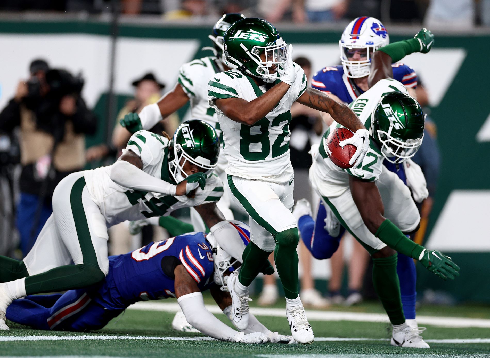 EAST RUTHERFORD, NEW JERSEY - SEPTEMBER 11: Wide receiver Xavier Gipson #82 of the New York Jets scores the game winning touchdown on a 65-yard punt return during the overtime quarter of the NFL game against the Buffalo Bills at MetLife Stadium on September 11, 2023 in East Rutherford, New Jersey. The Jets defeated the Bills 22-16 in overtime.