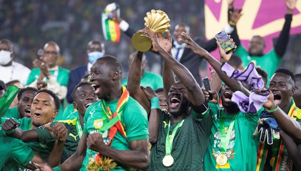 Senegal celebrate winning 2021 Africa Cup of Nations against Egypt in Yaounde on February 6, 2022 (Photo by