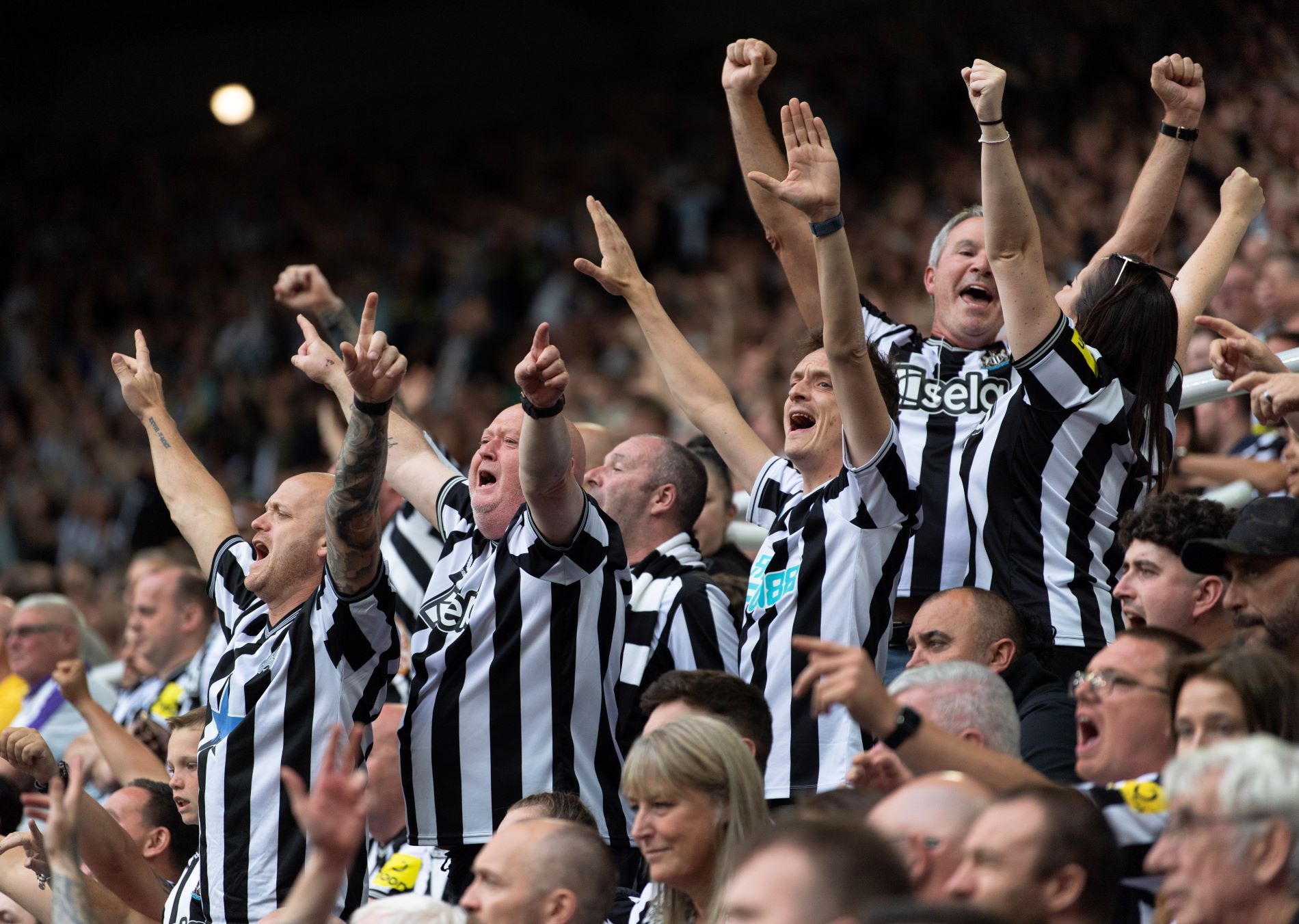 NEWCASTLE UPON TYNE, ENGLAND - AUGUST 12: Newcastle United fans singing during the Premier League match between Newcastle United and Aston Villa at St. James Park on August 12, 2023 in Newcastle upon Tyne, England. (Photo by