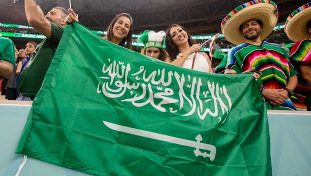 LUSAIL, QATAR - NOVEMBER 30: LUSAIL, QATAR - NOVEMBER 30: Saudi Arabia fans hold a flag before the Mexico versus Saudi Arabia Group C World Cup match at Lusail Stadium on November 30, 2022 in Lusail, Qatar. (Photo by
