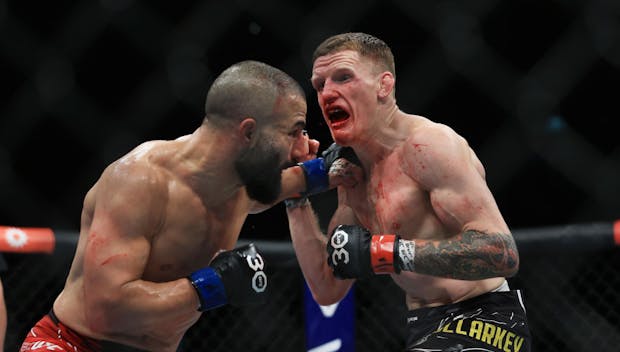 Jamie Mullarkey of Australia (R), trades punches with John Makdessi of Canada (L) during UFC 293