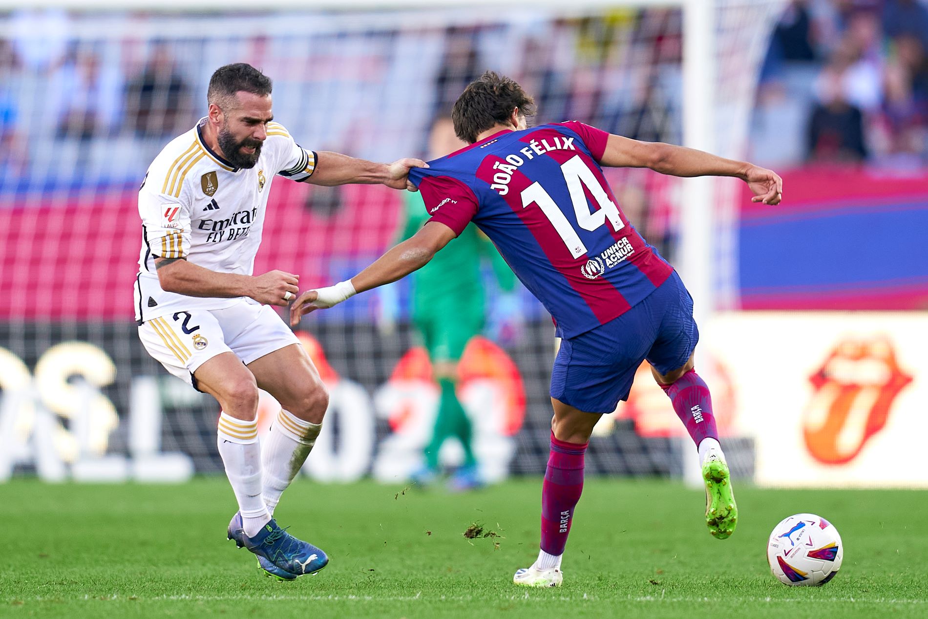 BARCELONA, SPAIN - OCTOBER 28: Joao Felix of FC Barcelona competes for the ball with Daniel Carvajal of Real Madrid during the LaLiga EA Sports match between FC Barcelona and Real Madrid CF at Estadi Olimpic Lluis Companys on October 28, 2023 in Barcelona, Spain. (Photo by Pedro Salado/Quality Sport Images/Getty Images)