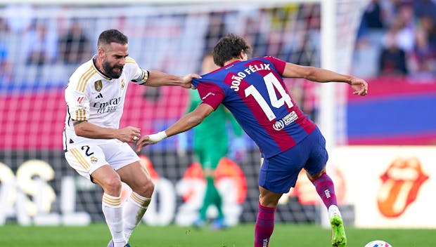BARCELONA, SPAIN - OCTOBER 28: Joao Felix of FC Barcelona competes for the ball with Daniel Carvajal of Real Madrid during the LaLiga EA Sports match between FC Barcelona and Real Madrid CF at Estadi Olimpic Lluis Companys on October 28, 2023 in Barcelona, Spain. (Photo by Pedro Salado/Quality Sport Images/Getty Images)