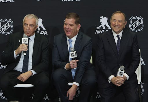 (L-R) IIHF president Luc Tarif, NHLPA executive director Marty Walsh and NHL commissioner Gary Bettman speak with the media on February 2, 2024