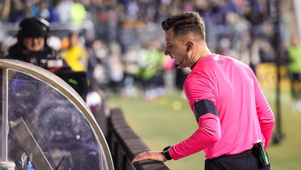 CHESTER, PENNSYLVANIA - FEBRUARY 25: Referee Lukasz Szpala reviews a VAR decision during the second half between Philadelphia Union and Columbus Crew at Subaru Park on February 25, 2023 in Chester, Pennsylvania. (Photo by Tim Nwachukwu/Getty Images)