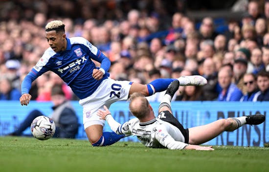 IPSWICH, ENGLAND - MARCH 16: Omari Hutchinson of Ipswich Town is tackled by s10 during the Sky Bet Championship match between Ipswich Town and Sheffield Wednesday at Portman Road on March 16, 2024 in Ipswich, England. (Photo by Justin Setterfield/Getty Images)