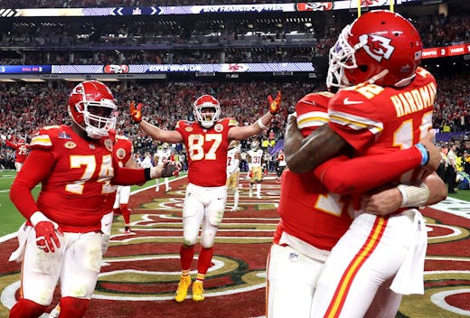 LAS VEGAS, NEVADA - FEBRUARY 11: Mecole Hardman Jr. #12 of the Kansas City Chiefs celebrates with Patrick Mahomes #15 and teammates after catching the game-winning touchdown pass to defeat the San Francisco 49ers 25-22 during Super Bowl LVIII at Allegiant Stadium on February 11, 2024 in Las Vegas, Nevada. (Photo by Ezra Shaw/Getty Images)