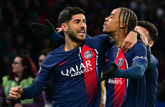 PARIS, FRANCE - APRIL 21: Bradley Barcola of PSG and Marco Asensio of PSG celebrate a goal during the Ligue 1 Uber Eats match between Paris Saint-Germain and Olympique Lyon at Parc des Princes on April 21, 2024 in Paris, France.(Photo by Christian Liewig - Corbis/Getty Images)