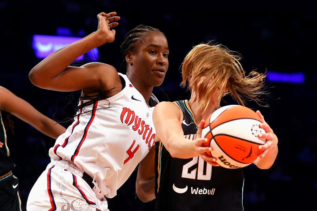 NEW YORK, NEW YORK - SEPTEMBER 10: Sabrina Ionescu #20 of the New York Liberty moves against Queen Egbo #4 of the Washington Mystics at Barclays Center on September 10, 2023 in the Brooklyn borough of New York City. NOTE TO USER: User expressly acknowledges and agrees that, by downloading and or using this photograph, User is consenting to the terms and conditions of the Getty Images License Agreement. The Mystics defeated the Liberty 90-88. (Photo by Bruce Bennett/Getty Images)