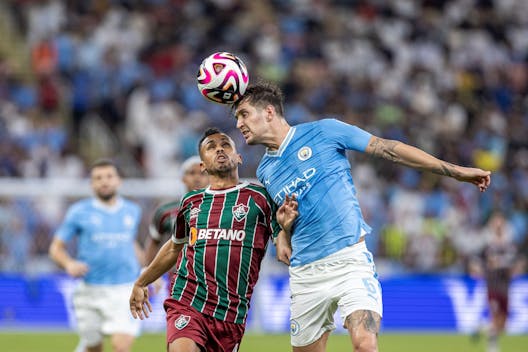 JEDDAH, SAUDI ARABIA - DECEMBER 22: Vinicius de Lima of Fluminense (L) and John Stones of Manchester City (R) battle for the ball during the FIFA Club World Cup Final match between Manchester City and Fluminense at King Abdullah Sports City on December 22, 2023 in Jeddah, Saudi Arabia. (Photo by Richard Callis/Eurasia Sport Images/Getty Images)