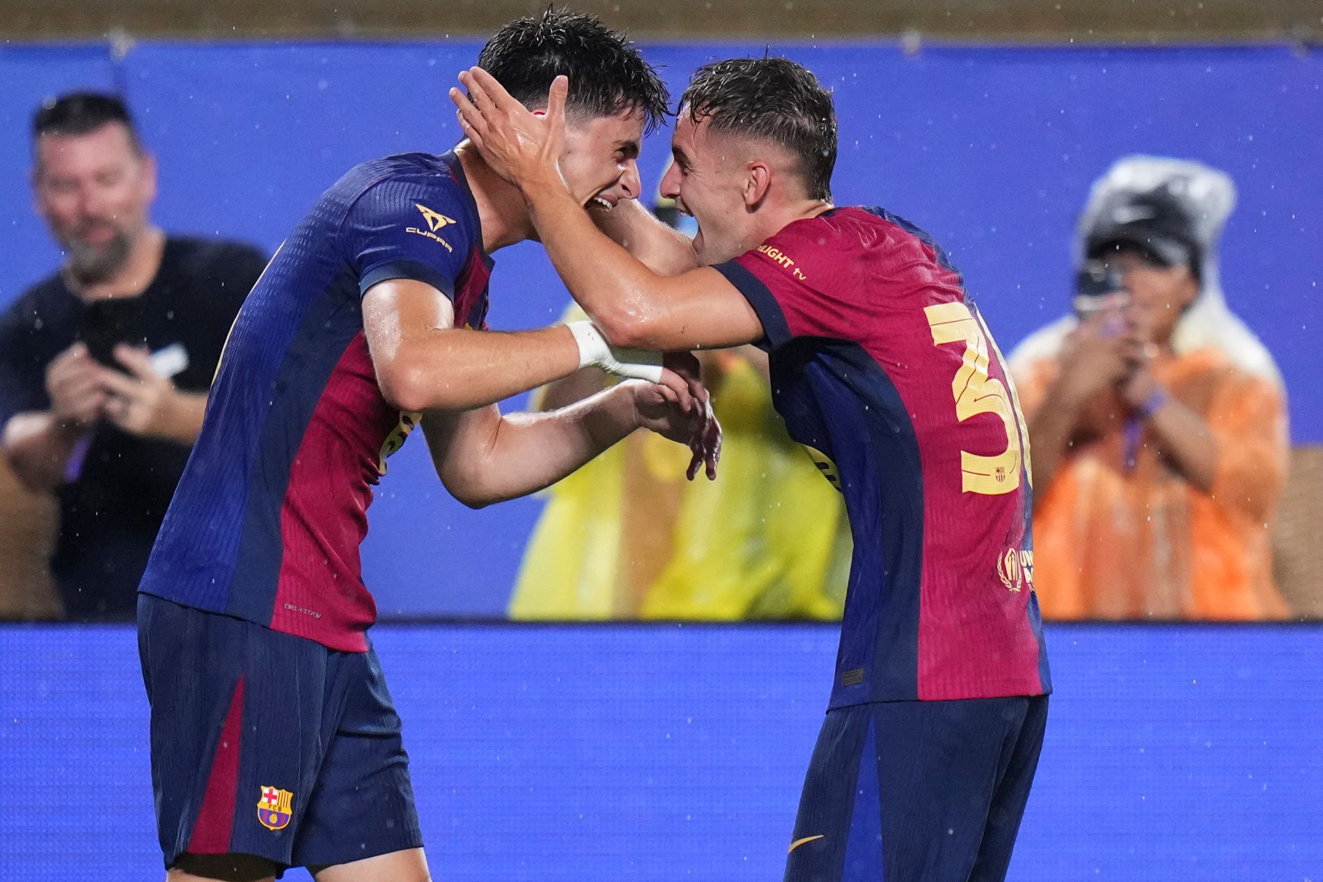 ORLANDO, FLORIDA - JULY 30: Pau Victor #8 of FC Barcelona celebrates with Marc Casadó #30 of FC Barcelona after scoring against Manchester City in the first half during a pre-season match between Manchester City and FC Barcelona at Camping World Stadium on July 30, 2024 in Orlando, Florida. (Photo by Rich Storry/Getty Images)