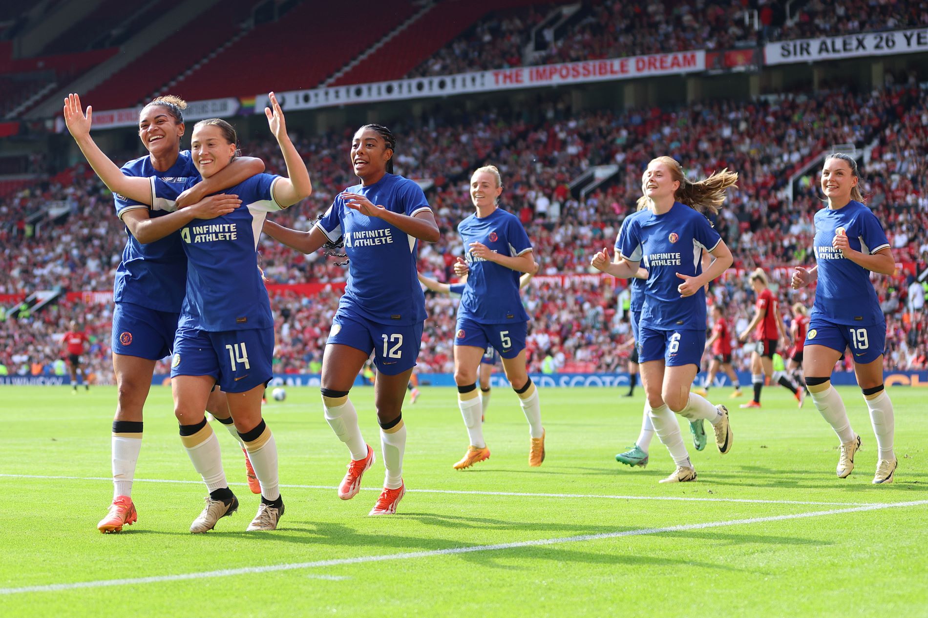 MANCHESTER, ENGLAND - MAY 18: Fran Kirby of Chelsea celebrates with teammates after scoring her team's sixth goal during the Barclays Women´s Super League match between Manchester United and Chelsea FC at Old Trafford on May 18, 2024 in Manchester, England. (Photo by Clive Brunskill/Getty Images)