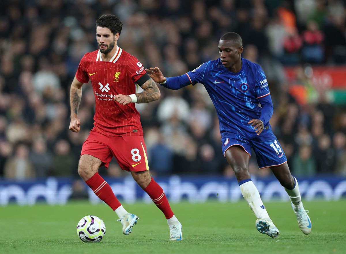LIVERPOOL, ENGLAND - OCTOBER 20: Dominik Szoboszlai of Liverpool battles for possession with Nicolas Jackson of Chelsea during the Premier League match between Liverpool FC and Chelsea FC at Anfield on October 20, 2024 in Liverpool, England. (Photo by Carl Recine/Getty Images)