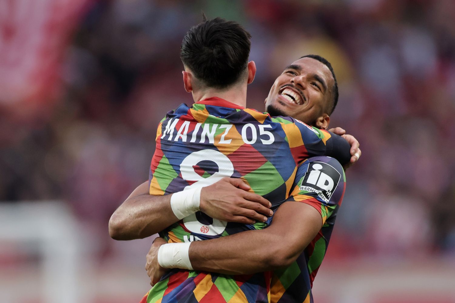 MAINZ, GERMANY - FEBRUARY 22: Paul Nebel of 1. FSV Mainz 05 celebrates the team's second goal with teammate Moritz Jenz during the Bundesliga match between 1. FSV Mainz 05 and FC St. Pauli 1910 at MEWA Arena on February 22, 2025 in Mainz, Germany. (Photo by Alex Grimm/Getty Images)