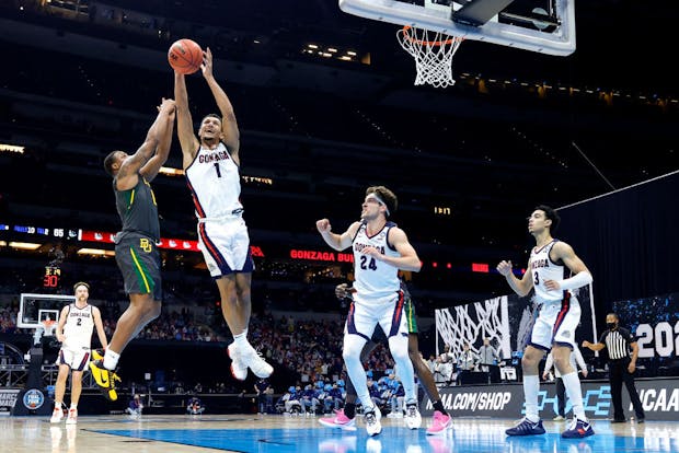 Jalen Suggs of the Gonzaga Bulldogs and Mark Vital of the Baylor Bears jump for a rebound in the National Championship game of the 2021 NCAA Men's Basketball Tournament (Photo by Tim Nwachukwu/Getty Images)
