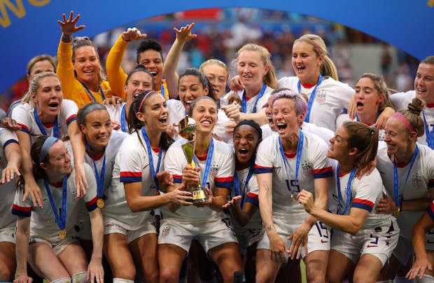 Carli Lloyd lifts the trophy as USA celebrate victory after the 2019 Fifa Women's World Cup final match against the Netherlands (by Richard Heathcote/Getty Images)