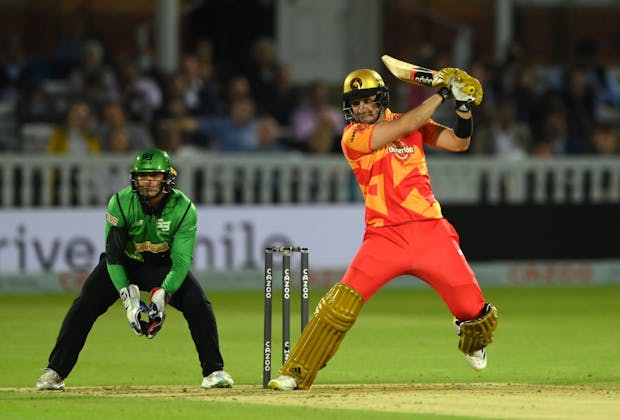 Birmingham Phoenix batter Liam Livingstone hits out watched by Alex Davies of the Southern Brave during The Hundred 2021 final match (by Stu Forster/Getty Images)