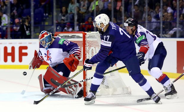Ben Bowns of Great Britain tends net against Sacha Treille #77 of France during the 2019 IIHF Ice Hockey World Championship (by Martin Rose/Getty Images)