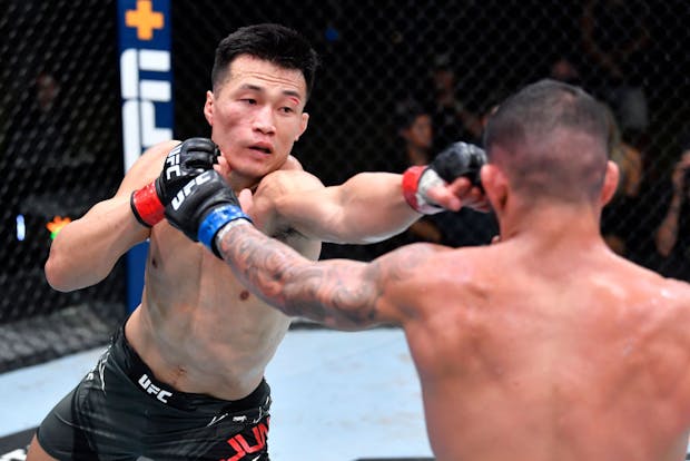 'The Korean Zombie' Chan Sung Jung (L) of South Korea punches Dan Ige at UFC APEX on June 19, 2021 in Las Vegas. (Photo by Chris Unger/Zuffa LLC)